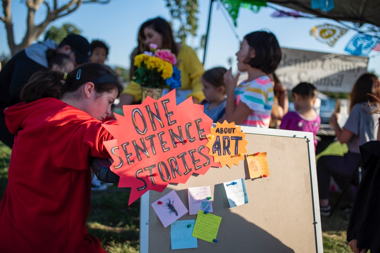 Kids involved in outdoor art exhibition at city park in Hollister, California